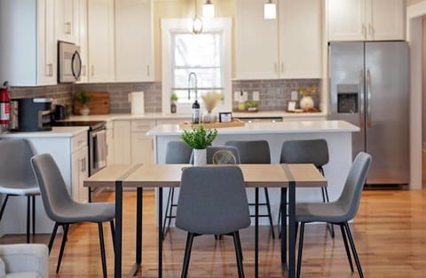 Dining table can seat 6 and the island has three bar stools.