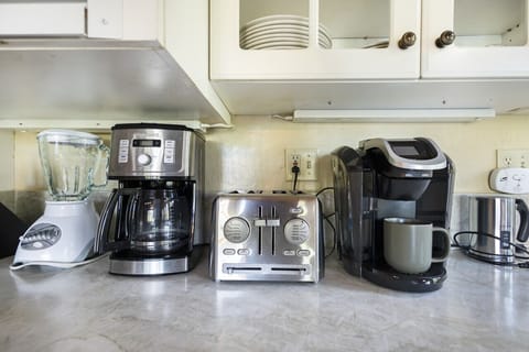 Fully stocked coffee and beverage station.