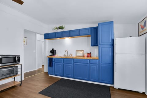 The hallway to the left of the kitchenette leads to the bedrooms and bathroom