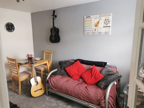 Dining room/living room. Smart tv, wifi and play the guitars!