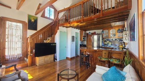 Open kitchen / living room with loft bedroom