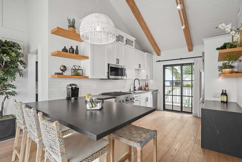 This bathroom has a single vanity, bath tub and modern fixtures.