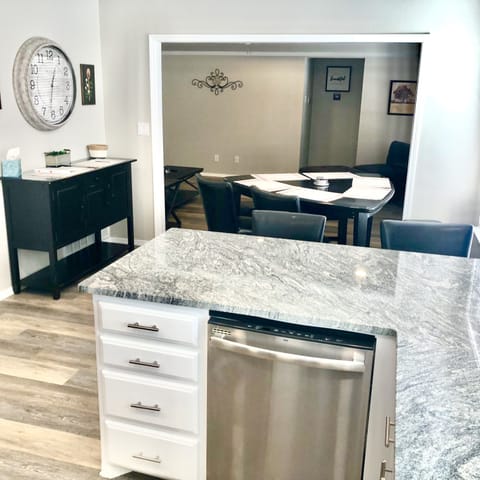 Kitchen island with bar stools and dining room table