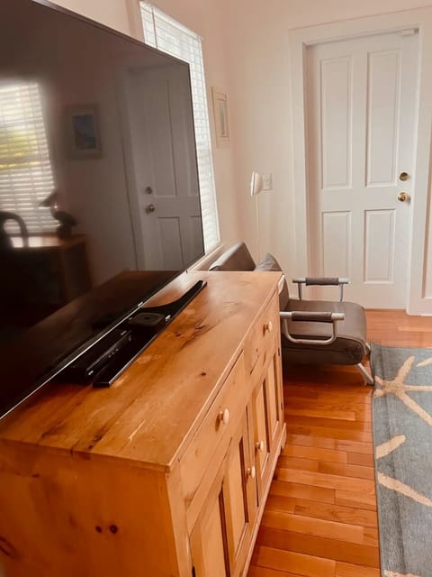 Large TV in the Master for cozy movie nights.