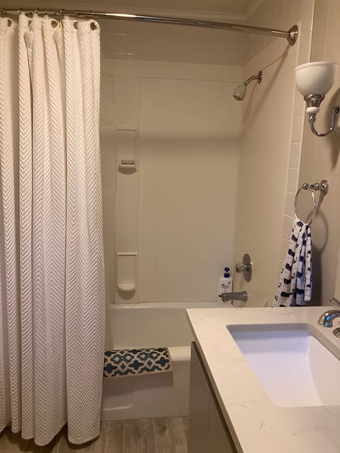 Combined shower/tub, hair dryer, towels, soap