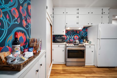 Large Vibrant Kitchen with Oven and Fridge