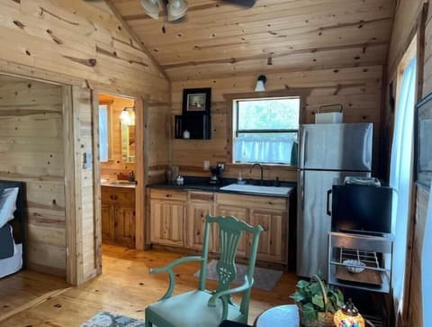 Kitchen includes dishes, spices and utensils for cooking light meals.