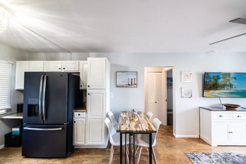 Full-sized refrigerator and seating for 4