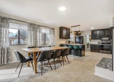 Our dining area, next to the kitchen, provides the utmost convenience. Enjoy your meals in beautiful natural light from large windows at Evergreen Luxe.