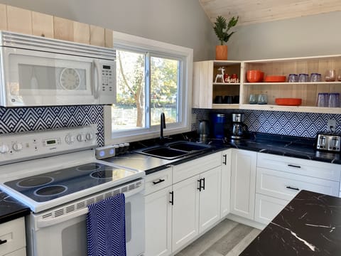 The kitchen has everything you need to prepare and serve a full course meal.