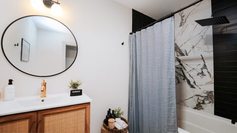 Combined shower/tub, hair dryer, towels, soap