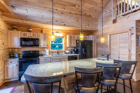 Kitchen - Kitchen with island and bar stools