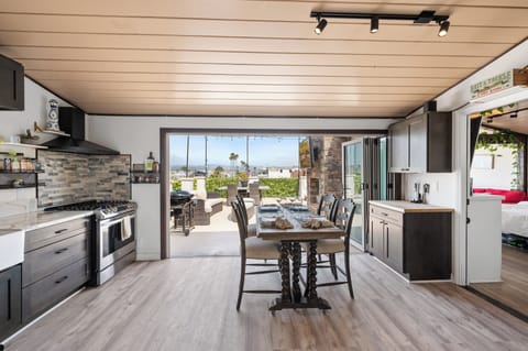 kitchen to outdoors balcony, bedroom access to the right side
