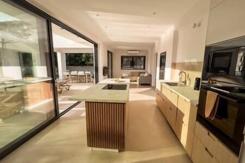 Fully equipped kitchen overlooking pool