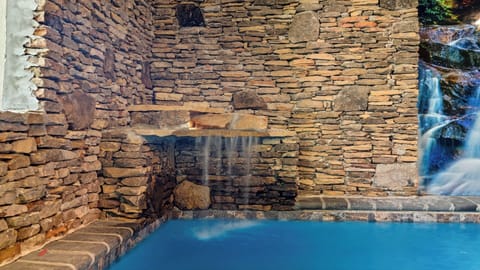 Smoky Mountains private pool cabin with waterfall.