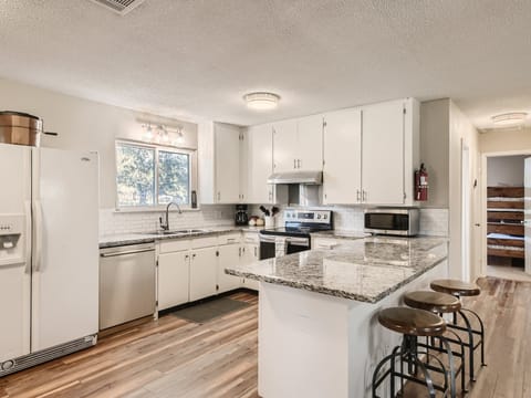 Ranch house kitchen with bar seating