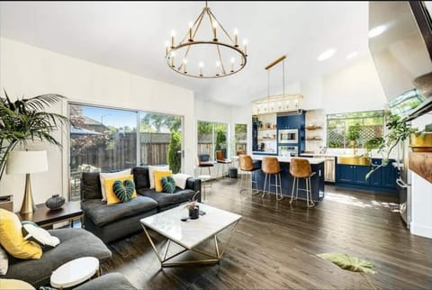 Your gathering place.
Living Room with Fireplace, Bar, Smart TV and adjacent Kitchen