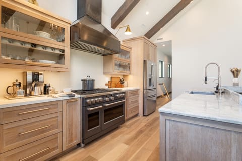 Chefs' kitchen: GE Cafe Appliances, Caraway ceramic cookware, Culligan RO water filter, Wolf warming drawer & built in microwave