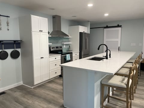 Newly remodeled kitchen all cookware at arm's reach.