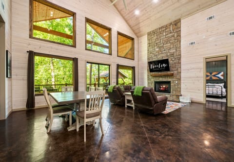 The sunlit living room offers a spacious, bright setting to relax and unwind after a day of exploring.