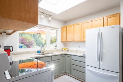 Bright and functional kitchen next to dining area, making for easy hosting