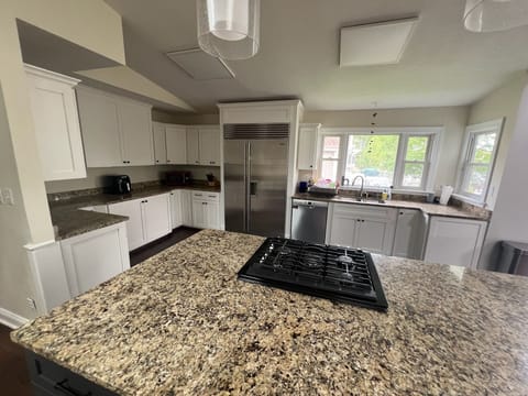 Large island provides extra seating and serving space for large family meals.