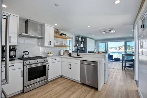 KITCHEN — This fully equipped kitchen has everything you need to prepare delicious snacks for movie nights and full meals during your stay. Enjoy the convenience of a coffee pot (grounds or pods), blender, rice cooker, tea kettle, and toaster.
