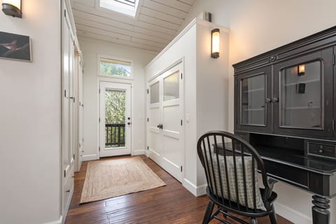 Bring work, if you must - there's a desk in the master suite - and a door to the back deck and hot tub.