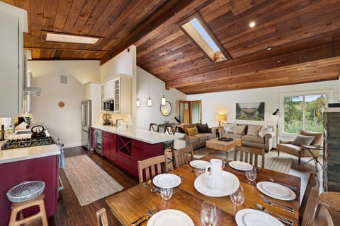 Easy flow of food, wine, and conversation between the kitchen and dining table.