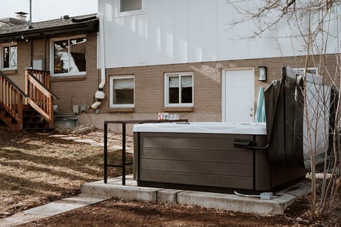  Relax in the private backyard hot tub retreat, perfect for unwinding day or night.