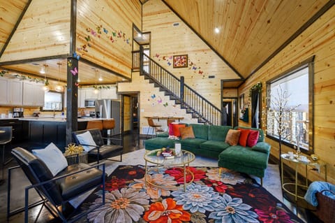 The spacious living room provides amble seating and fun fairy tale elements throughout the room