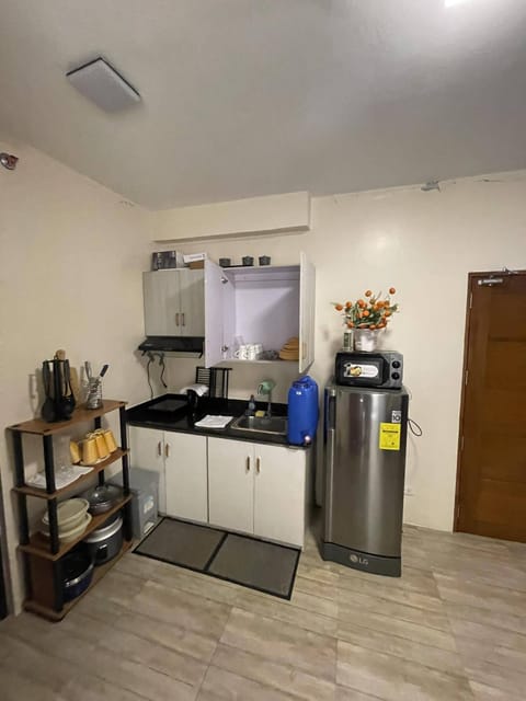 Fridge, microwave, electric kettle, cookware/dishes/utensils