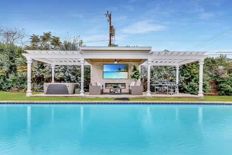 Dive into luxury with an open-air cinema and stylish lounge area, your exclusive entertainment enclave.