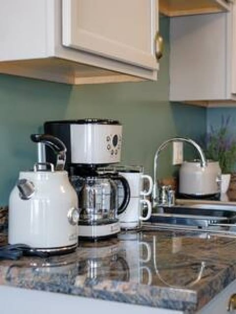 Fridge, coffee/tea maker, cookware/dishes/utensils