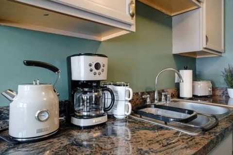 Fridge, coffee/tea maker, cookware/dishes/utensils