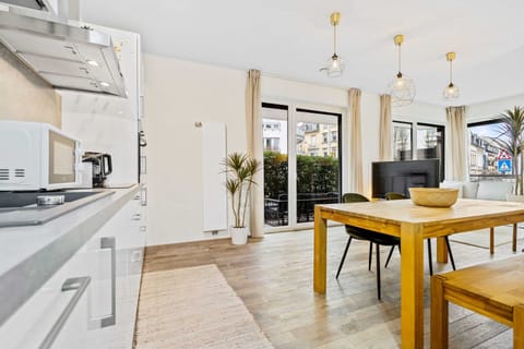 Dine and entertain in our open-plan space, featuring a fully equipped modern kitchen