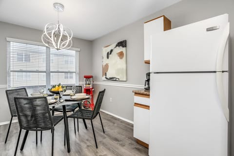 Step into the spotlight of this well-lit kitchen, where a full-size fridge keeps your breakfast of champions chilled and ready to fuel your day with a grin!