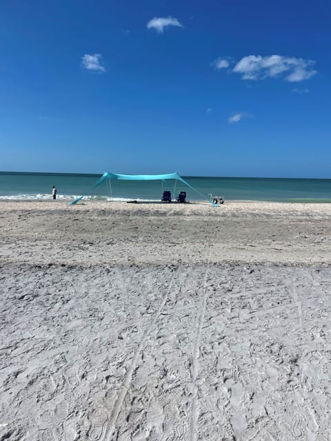 On the beach, sun loungers, beach towels