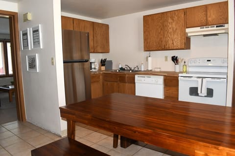 Full kitchen with range/oven, dishwasher, coffee maker, microwave, refrigerator and most other small appliances. Plenty of dishes, cookware, and utensils.