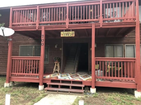 The condos feature an outside porch area for relaxing. There is a barbeque grill available for use along side the picnic tables just off of the porch area.