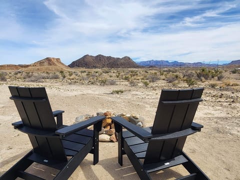 Immerse yourself in the magic of the night sky with a cozy campfire.