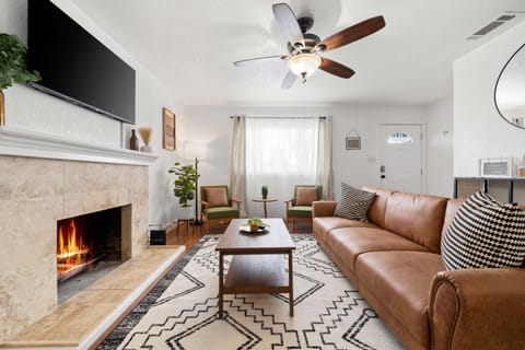 Enjoy the warm ambience of our cozy living room. Perfect for movie night.