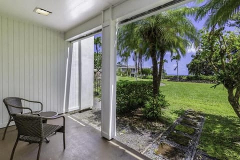 Enjoy your morning coffee on the large lanai that overlooks the garden and ocean