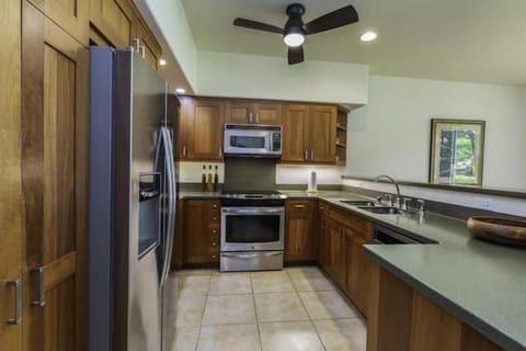 Open concept kitchen with newer Whirlpool and Kenmore stainless steel appliances