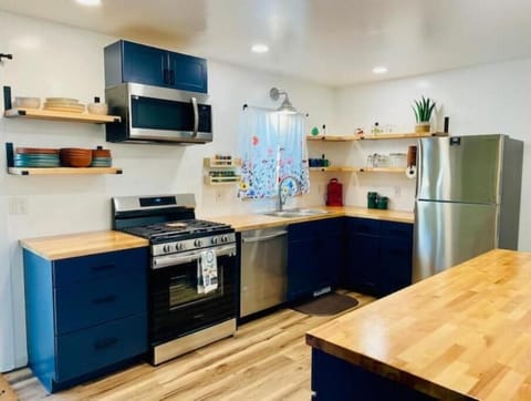 Cook your meals at home in the fully stocked appealing kitchen.