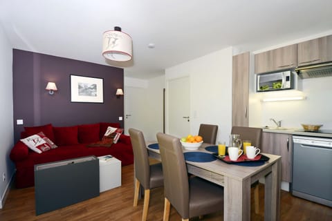 The lovely open-concept living area provides a relaxing atmosphere for your stay.