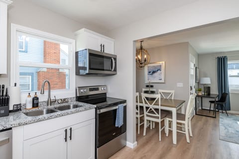 Fully equipped with a full-size oven, stove, microwave, and dishwasher, making meal prep a breeze.