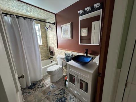 Combined shower/tub, hair dryer, towels, toilet paper