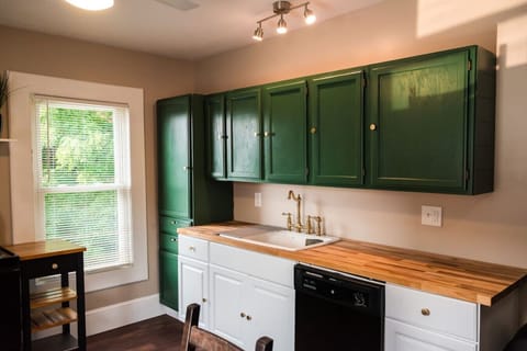 The well-lit and fully stocked kitchen includes a dishwasher