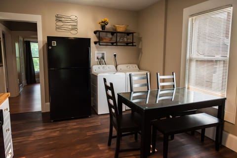 We also have a full sized refrigerator, clothes washer and dryer in the unit for your convenience.The table expands to accommodate additional seats. It is currently set up for 5 seats, but can include an additional 3 -4 .